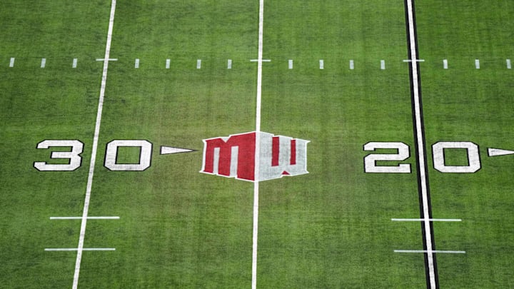 The Mountain West conference logo on the field at Allegiant Stadium. 