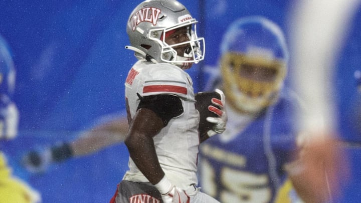 UNLV Rebels running back Jai'Den Thomas (9) runs for a touchdown against the San Jose State Spartans during the third quarter at CEFCU Stadium. Mandatory Credit: D. Ross Cameron-Imagn Images