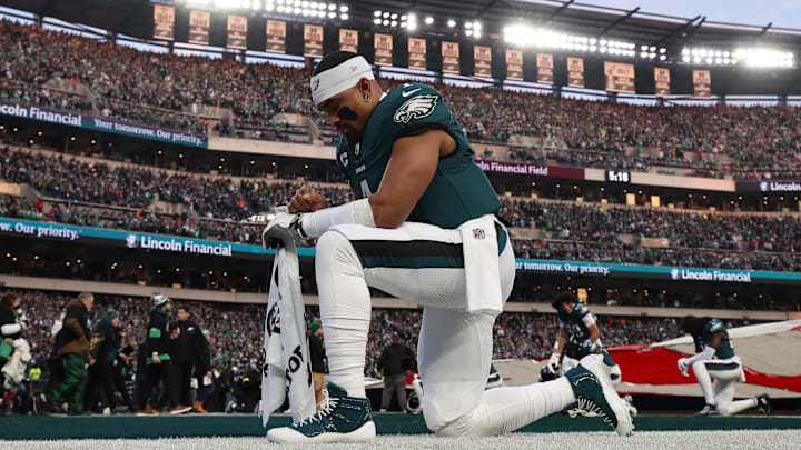 Jan 12, 2025; Philadelphia, Pennsylvania, USA; Philadelphia Eagles quarterback Jalen Hurts (1) kneels before the game in the end zone in an NFC wild card game at Lincoln Financial Field. Jan 12, 2025; Philadelphia, Pennsylvania, USA; Philadelphia Eagles quarterback Jalen Hurts (1) kneels before the game in the end zone in an NFC wild card game at Lincoln Financial Field.