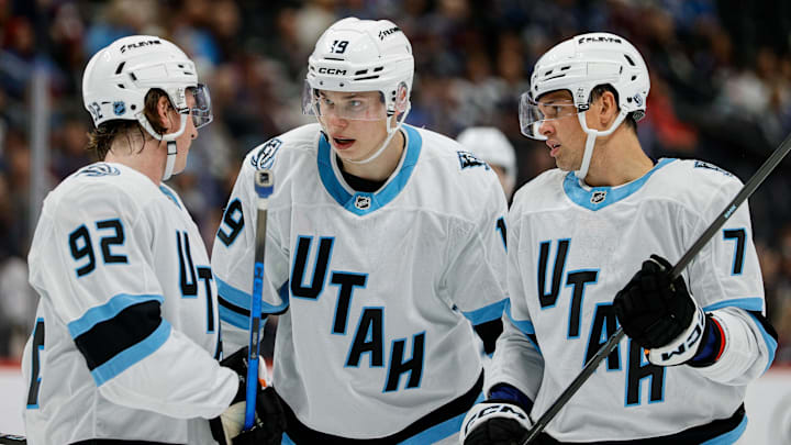 Sep 21, 2025; Denver, Colorado, USA; Utah Mammoth left wing Daniil But (19) and center Logan Cooley (92) and right wing JJ Peterka (77) in the first period against the Colorado Avalanche at Ball Arena. Mandatory Credit: Isaiah J. Downing-Imagn Images