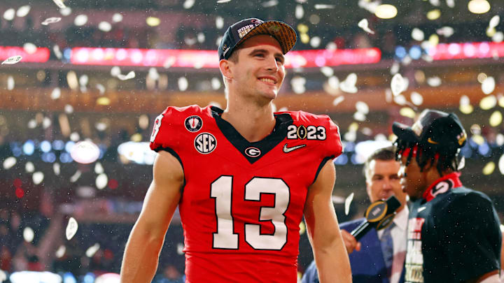 Jan 9, 2023; Inglewood, CA, USA; Georgia Bulldogs quarterback Stetson Bennett (13) celebrates after winning the CFP national championship game against the TCU Horned Frogs at SoFi Stadium. Mandatory Credit: Mark J. Rebilas-Imagn Images