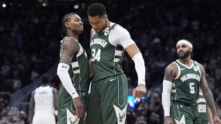 Apr 8, 2025; Milwaukee, Wisconsin, USA; Milwaukee Bucks guard Kevin Porter Jr. (3) and Milwaukee Bucks forward Giannis Antetokounmpo (34) celebrate as the clock winds down in their 110-103 comeback victory over the Minnesota Timberwolves at Fiserv Forum. Mandatory Credit: Michael McLoone-Imagn Images