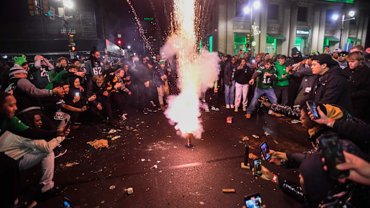 Eagles fans celebrate their Super Bowl victory with fireworks.