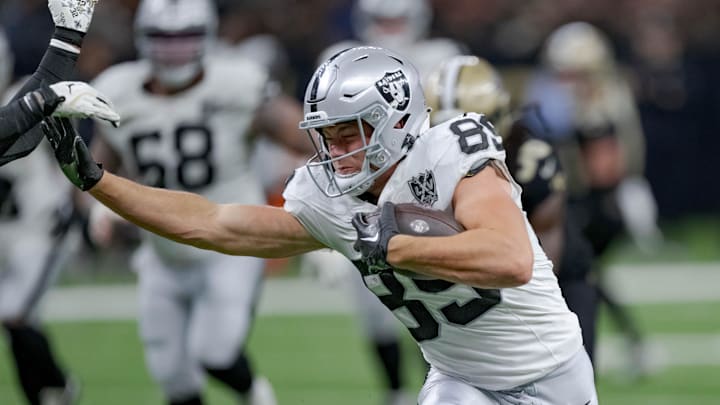 Dec 29, 2024; New Orleans, Louisiana, USA; Las Vegas Raiders tight end Brock Bowers (89) runs against New Orleans Saints safety Tyrann Mathieu (32) during the third quarter at Caesars Superdome. Mandatory Credit: Matthew Hinton-Imagn Images