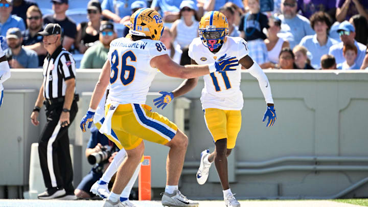 Oct 5, 2024; Chapel Hill, North Carolina, USA;  Pittsburgh Panthers wide reciever Censere Lee (11) celebrates with tight end Gavin Bartholomew (86) after scoring a touchdown in the second quarter at Kenan Memorial Stadium. Mandatory Credit: Bob Donnan-Imagn Images
