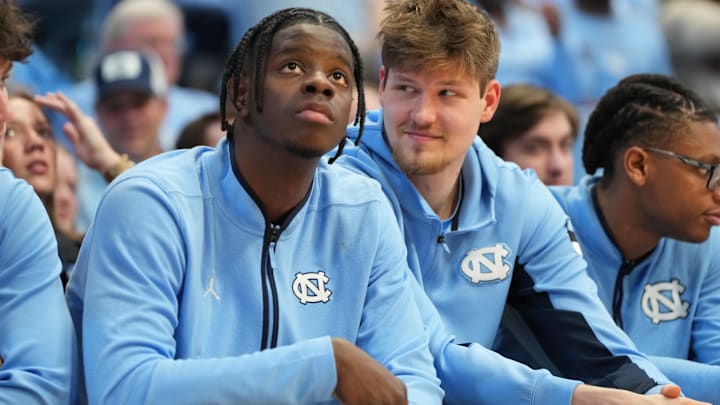 Feb 14, 2026; Chapel Hill, North Carolina, USA; North Carolina Tar Heels forward Caleb Wilson (8) and center Henri Veesaar (13) on the bench in the second half at Dean E. Smith Center. Mandatory Credit: Bob Donnan-Imagn Images