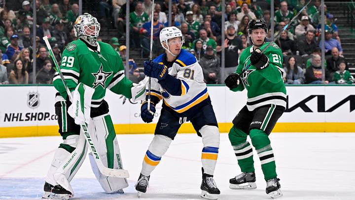 Mar 2, 2025; Dallas, Texas, USA; Dallas Stars goaltender Jake Oettinger (29) and defenseman Esa Lindell (23) and St. Louis Blues left wing Dylan Holloway (81) in action during the game between the Dallas Stars and the St. Louis Blues at the American Airlines Center. Mandatory Credit: Jerome Miron-Imagn Images