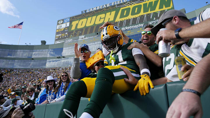 Sep 7, 2025; Green Bay, Wisconsin, USA; Green Bay Packers wide receiver Jayden Reed (11) celebrates with fans after scoring a touchdown against the Detroit Lions during the second quarter at Lambeau Field. Mandatory Credit: Jeff Hanisch-Imagn Images Sep 7, 2025; Green Bay, Wisconsin, USA; Green Bay Packers wide receiver Jayden Reed (11) celebrates with fans after scoring a touchdown against the Detroit Lions during the second quarter at Lambeau Field. Mandatory Credit: Jeff Hanisch-Imagn Images