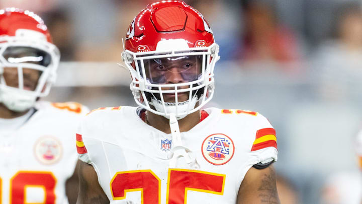 Aug 9, 2025; Glendale, Arizona, USA; Kansas City Chiefs running back Elijah Mitchell (25) against the Arizona Cardinals during a preseason NFL game at State Farm Stadium.
