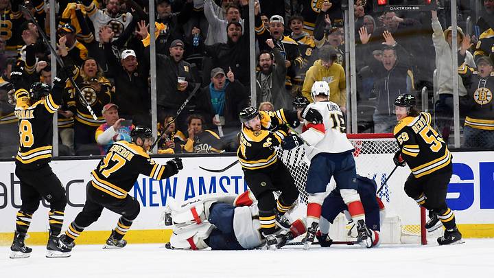 Apr 26, 2023; Boston, Massachusetts, USA; Boston Bruins left wing Brad Marchand (63) reacts with right wing David Pastrnak (88) left wing Tyler Bertuzzi (59) and center Patrice Bergeron (37) after scoring a goal during the second period in game five of the first round of the 2023 Stanley Cup Playoffs against the Florida Panthers at TD Garden. Mandatory Credit: Bob DeChiara-USA TODAY Sports