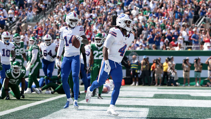 Sep 14, 2025; East Rutherford, New Jersey, USA; Buffalo Bills running back James Cook (4) reacts after scoring a touchdown against the New York Jets during the first half at MetLife Stadium. Mandatory Credit: Vincent Carchietta-Imagn Images