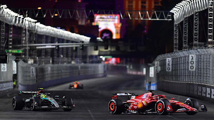 Nov 23, 2024; Las Vegas, Nevada, USA; Scuderia Ferrari driver Charles Leclerc (16) leads Mercedes AMG Petronas driver Lewis Hamilton (44) during the Las Vegas Grand Prix at Las Vegas Circuit. Mandatory Credit: Gary A. Vasquez-Imagn Images