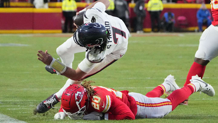 Jan 18, 2025; Kansas City, Missouri, USA; Houston Texans quarterback C.J. Stroud (7) runs for a first down against Kansas City Chiefs safety Justin Reid (20) during the third quarter of a 2025 AFC divisional round game at GEHA Field at Arrowhead Stadium. Mandatory Credit: Denny Medley-Imagn Images Jan 18, 2025; Kansas City, Missouri, USA; Houston Texans quarterback C.J. Stroud (7) runs for a first down against Kansas City Chiefs safety Justin Reid (20) during the third quarter of a 2025 AFC divisional round game at GEHA Field at Arrowhead Stadium. Mandatory Credit: Denny Medley-Imagn Images