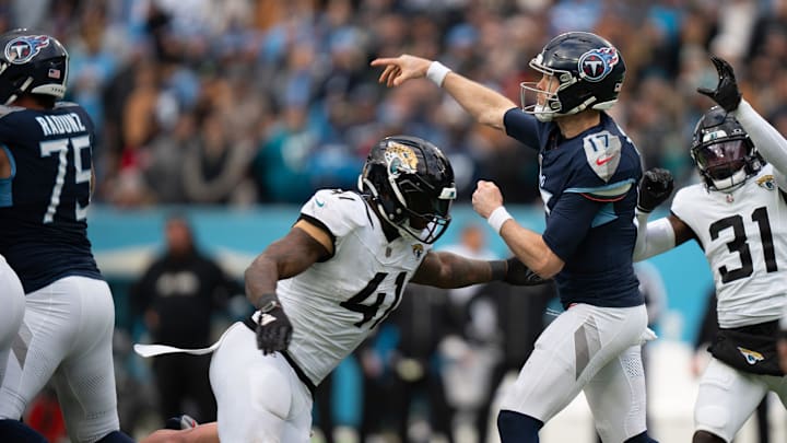 Tennessee Titans quarterback Ryan Tannehill (17) gets off a pass ahead of Jacksonville Jaguars
