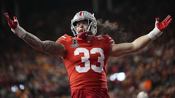 Ohio State Buckeyes defensive end Jack Sawyer (33) celebrates a sack of Tennessee Volunteers quarterback Nico Iamaleava (8) during the first half of the College Football Playoff first round game at Ohio Stadium in Columbus on Dec. 21, 2024.