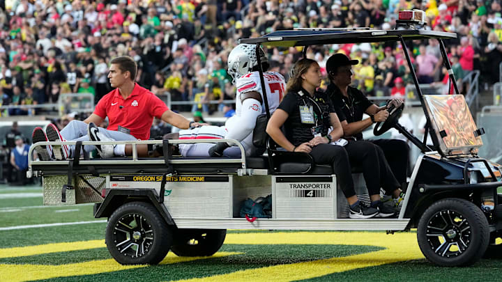 Oct 12, 2024; Eugene, Oregon, USA; Ohio State Buckeyes left tackle Josh Simmons is carted off the field during the first half of the NCAA football game against the Oregon Ducks at Autzen Stadium