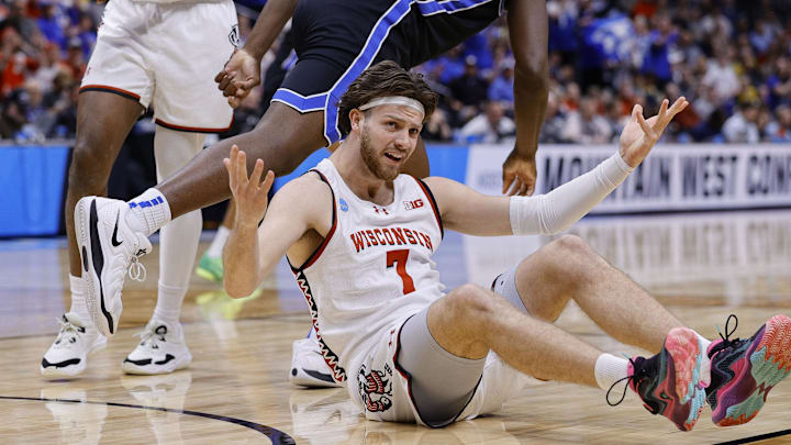 Mar 22, 2025; Denver, CO, USA; Wisconsin Badgers forward Carter Gilmore (7) reacts against the Brigham Young Cougars during the second half in the second round of the NCAA Tournament  at Ball Arena. Mandatory Credit: Isaiah J. Downing-Imagn Images