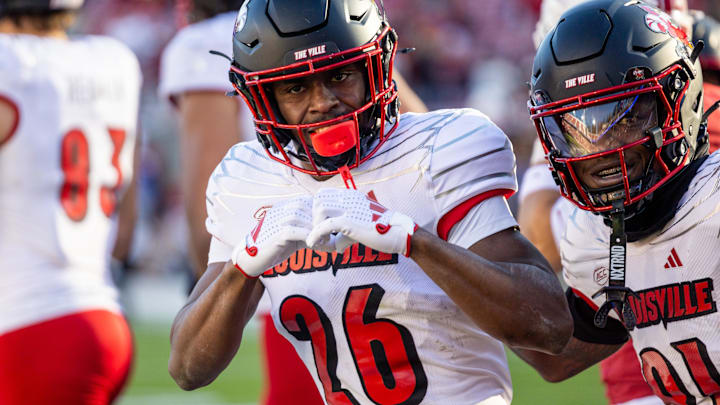 Nov 16, 2024; Stanford, California, USA;  Louisville Cardinals running back Duke Watson (26) celebrates his touchdown during the third quarter against the Stanford Cardinal at Stanford Stadium. Mandatory Credit: Bob Kupbens-Imagn Images