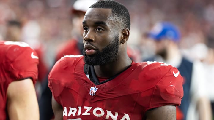 Aug 9, 2025; Glendale, Arizona, USA; Arizona Cardinals running back Trey Benson (33) against the Kansas City Chiefs during a preseason NFL game at State Farm Stadium.