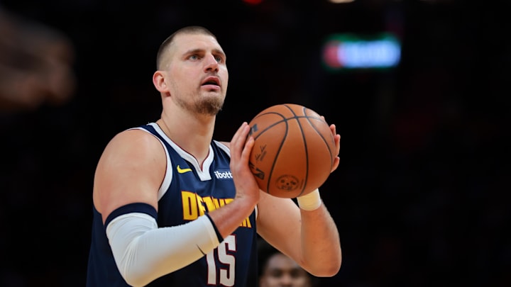 Dec 29, 2025; Miami, Florida, USA; Denver Nuggets center Nikola Jokic (15) shoots a free throw against the Miami Heat during the first quarter at Kaseya Center. Mandatory Credit: Sam Navarro-Imagn Images