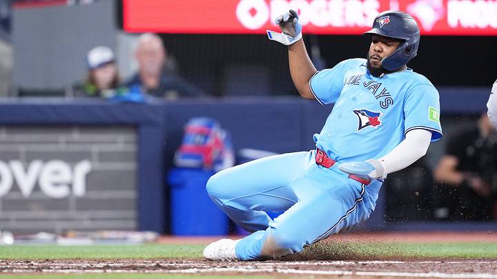 Toronto Blue Jays first baseman Vladimir Guerrero Jr. (27) slides into home plate. Toronto Blue Jays first baseman Vladimir Guerrero Jr. (27) slides into home plate.