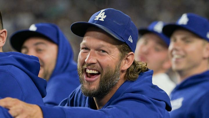 Oct. 1, 2025; Los Angeles, California, USA; Los Angeles Dodgers pitcher Clayton Kershaw (22) smiles in the dugout in the sixth inning against the Cincinnati Reds during game two of the Wildcard round for the 2025 MLB playoffs at Dodger Stadium. Oct. 1, 2025; Los Angeles, California, USA; Los Angeles Dodgers pitcher Clayton Kershaw (22) smiles in the dugout in the sixth inning against the Cincinnati Reds during game two of the Wildcard round for the 2025 MLB playoffs at Dodger Stadium.