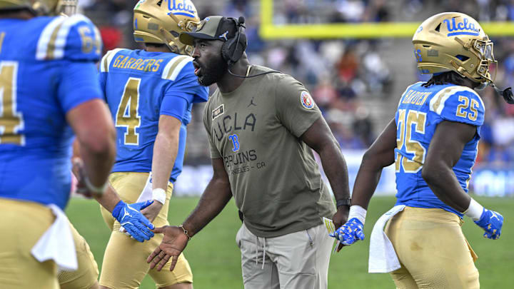 Nov 30, 2024; Pasadena, California, USA; UCLA Bruins head coach DeShaun Foster greets his players after a Bruins touchdown against the Fresno State Bulldogs in the third quarter at Rose Bowl. Mandatory Credit: Robert Hanashiro-Imagn Images