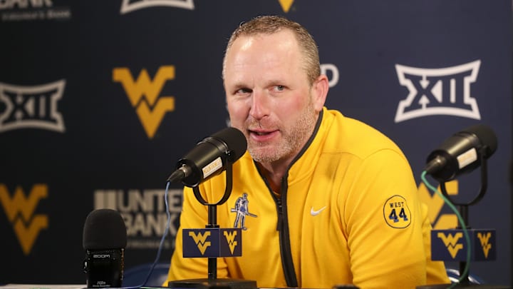 Feb 19, 2025; Morgantown, West Virginia, USA; West Virginia Mountaineers head coach Darian DeVries answers questions from the media after defeating the Cincinnati Bearcats at WVU Coliseum. Mandatory Credit: Ben Queen-Imagn Images