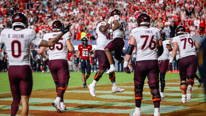 Sep 27, 2025; Raleigh, N.C.; Virginia Tech running back Marcellous Hawkins (27) makes a touchdown and celebrates with offensive lineman Johnny Garrett (79). Sep 27, 2025; Raleigh, N.C.; Virginia Tech running back Marcellous Hawkins (27) makes a touchdown and celebrates with offensive lineman Johnny Garrett (79).