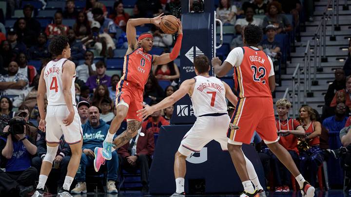 Mar 19, 2026; New Orleans, Louisiana, USA; New Orleans Pelicans guard Jeremiah Fears (0) looks to pass between LA Clippers guard Kobe Sanders (4) and guard Bogdan Bogdanovic (7) during the second half at Smoothie King Center. Mandatory Credit: Matthew Hinton-Imagn Images