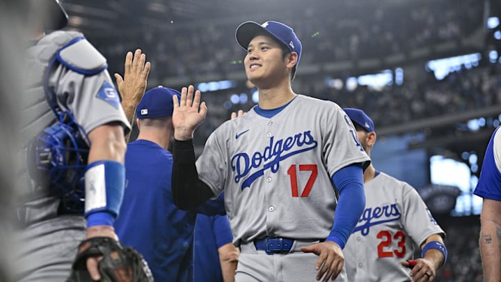 Apr 20, 2025; Arlington, Texas, USA; Los Angeles Dodgers designated hitter Shohei Ohtani (17) celebrates with his teammates after the Dodgers defeat the Texas Rangers at Globe Life Field. Mandatory Credit: Jerome Miron-Imagn Images