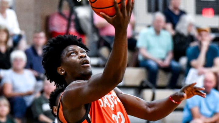 Team Snipes and Michigan State's Trey Fort scores against Team SPS during the Moneyball Pro-Am on Tuesday, July 15, 2025, at Holt High School. Team Snipes and Michigan State's Trey Fort scores against Team SPS during the Moneyball Pro-Am on Tuesday, July 15, 2025, at Holt High School.