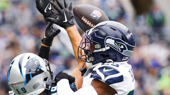 Sep 24, 2023; Seattle, Washington, USA; Seattle Seahawks cornerback Artie Burns (23) defends a pass intended for Carolina Panthers wide receiver Adam Thielen (19) during the second quarter at Lumen Field. Mandatory Credit: Joe Nicholson-Imagn Images