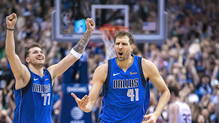 Apr 9, 2019; Dallas, TX, USA; Dallas Mavericks forward Dirk Nowitzki (41) and guard Luka Doncic (77) celebrate during the game against the Phoenix Suns at the American Airlines Center. Mandatory Credit: Jerome Miron-Imagn Images