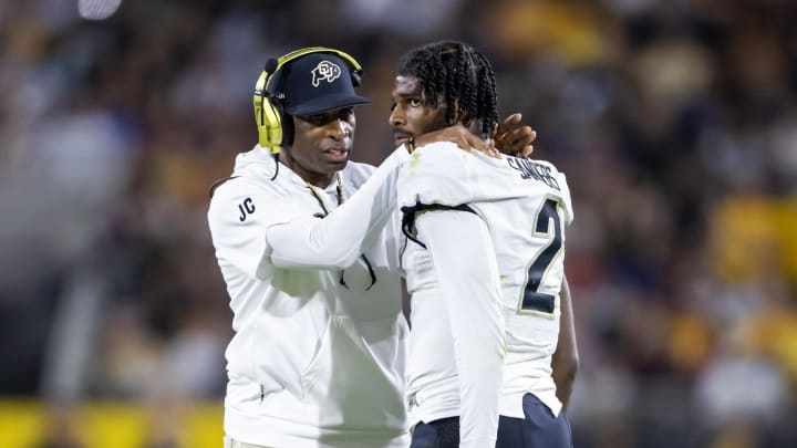 Oct 7, 2023; Tempe, Arizona, USA; Colorado Buffaloes head coach Deion Sanders with son and quarterback Shedeur Sanders (2) against the Arizona State Sun Devils at Mountain America Stadium. Mandatory Credit: Mark J. Rebilas-USA TODAY Sports