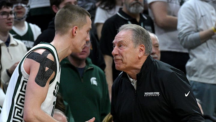 Feb 7, 2026; East Lansing, Michigan, USA;  Michigan State Spartans head coach Tom Izzo spits at Michigan State Spartans guard Denham Wojcik (10) during the first half against the Illinois Fighting Illini at Jack Breslin Student Events Center. Mandatory Credit: Dale Young-Imagn Images