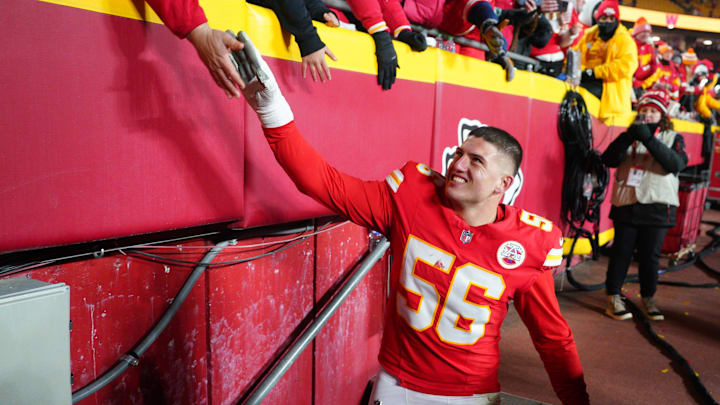 Jan 18, 2025; Kansas City, Missouri, USA; Kansas City Chiefs defensive end George Karlaftis (56) greets fans while leaving the field after a 2025 AFC divisional round game against the Houston Texans at GEHA Field at Arrowhead Stadium. Mandatory Credit: Denny Medley-Imagn Images