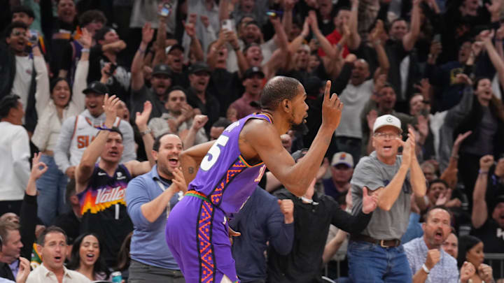 Mar 4, 2025; Phoenix, Arizona, USA; Phoenix Suns forward Kevin Durant (35) celebrates a three point basket against LA Clippers forward Kawhi Leonard (2) during the second half at PHX Center. Mandatory Credit: Joe Camporeale-Imagn Images
