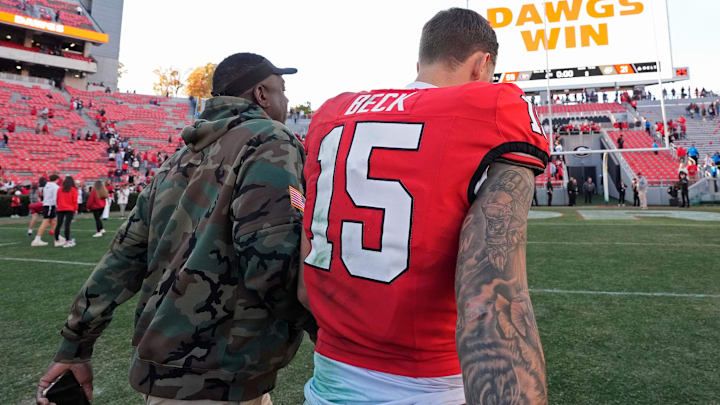 Georgia quarterback Carson Beck (15) leaves the field after a NCAA college football game against Massachusetts in Athens, Ga.