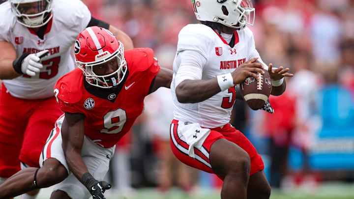 Sep 6, 2025; Athens, Georgia, USA; Georgia Bulldogs linebacker Chris Cole (9) sacks Austin Peay Governors quarterback Chris Parson (3) in the first quarter at Sanford Stadium. Mandatory Credit: Brett Davis-Imagn Images