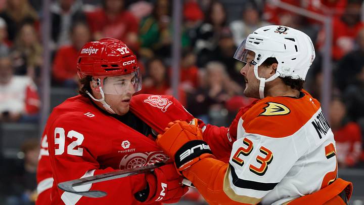 Nov 13, 2025; Detroit, Michigan, USA;  Detroit Red Wings center Marco Kasper (92) and Anaheim Ducks center Mason McTavish (23) shove each other in the first period at Little Caesars Arena. Mandatory Credit: Rick Osentoski-Imagn Images