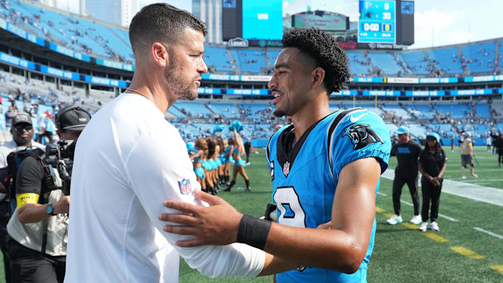 Sep 21, 2025; Charlotte, North Carolina, USA;  Carolina Panthers head coach Dave Canales with quarterback Bryce Young (9) after the game at Bank of America Stadium. Mandatory Credit: Bob Donnan-Imagn Images