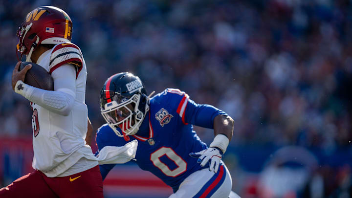 New York Giants linebacker Brian Burns (0) chases down Washington Commanders quarterback Jayden Daniels (5) during a game between the New York Giants and the Washington Commanders at MetLife Stadium in East Rutherford on Sunday, Nov. 3, 2024. New York Giants linebacker Brian Burns (0) chases down Washington Commanders quarterback Jayden Daniels (5) during a game between the New York Giants and the Washington Commanders at MetLife Stadium in East Rutherford on Sunday, Nov. 3, 2024.