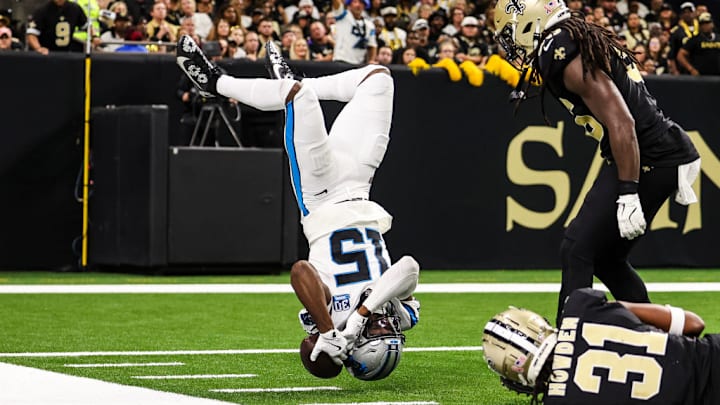 NEW ORLEANS, LA - SEPTEMBER 08: Jonathan Mingo #15 of the Carolina Panthers leaps over a New Orleans Saints player during an NFL football game at Caesars Superdome on September 8, 2024 in New Orleans, Louisiana.