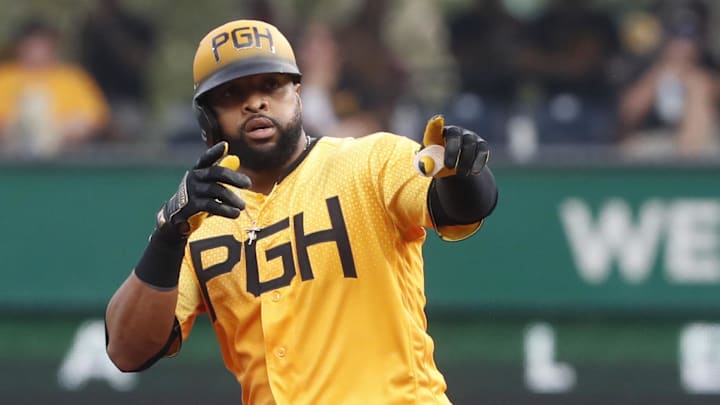 Jun 30, 2023; Pittsburgh, Pennsylvania, USA; Pittsburgh Pirates first baseman Carlos Santana (41) reacts at second base after hitting a double against the Milwaukee Brewers during the second inning at PNC Park. Mandatory Credit: Charles LeClaire-Imagn Images