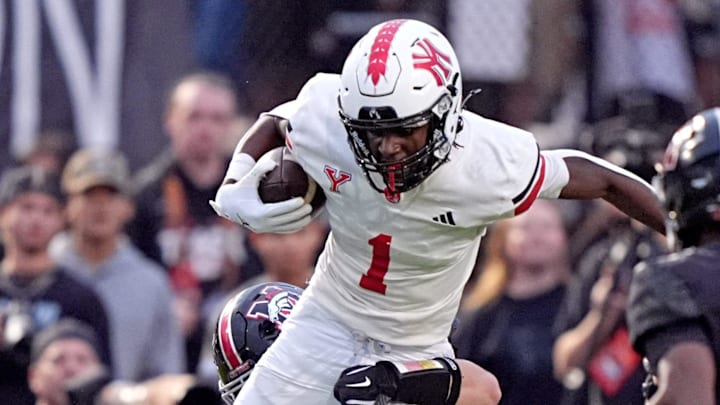 Yukon's Daniel Yebit tries to get by Mustang's Josiah Stevens during the high school game between Mustang and Yukon at Mustang High School in Mustang, Okla., Friday, Sept. 5, 2025.