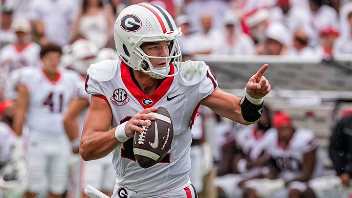 Sep 12, 2026; Athens, Georgia, USA;  Georgia Bulldogs quarterback Gunner Stockton (14) rolls out and runs against the Western Kentucky Hilltoppers during the first half at Sanford Stadium.  Mandatory Credit: Dale Zanine-Imagn Images