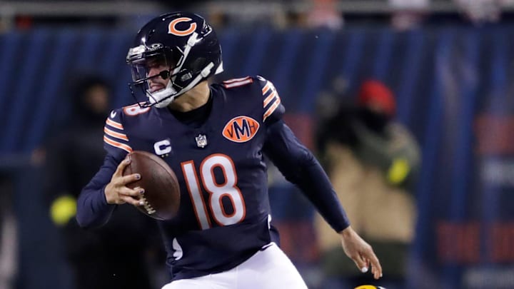Chicago Bears quarterback Caleb Williams (18) eludes Green Bay Packers defensive end Rashan Gary (52) during their football game Saturday, December 20, 2025, at Soldier Field in Chicago, Illinois.