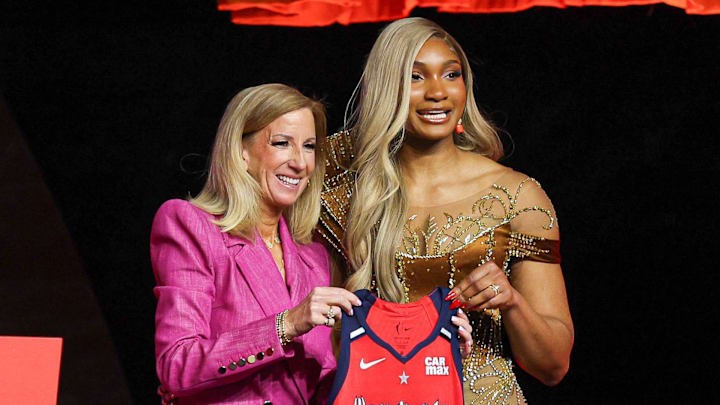 Apr 14, 2025; New York, New York, USA; Kiki Iriafen poses with WNBA commissioner Cathy Engelbert after being selected with the number four overall pick to the Washington Mystics in the 2025 WNBA Draft at The Shed at Hudson Yards. Mandatory Credit: Vincent Carchietta-Imagn Images 