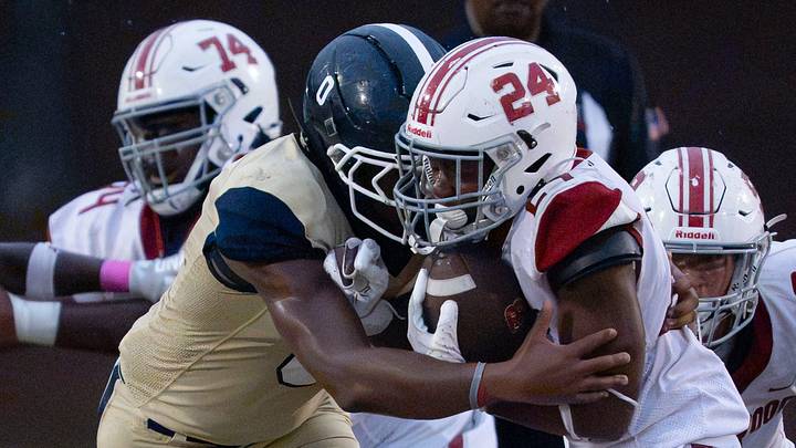 Paul Bryant's Cordarro Law (0) brings down Brookwood’s Christian Gibson (24) at Paul W. Bryant High. Paul Bryant's Cordarro Law (0) brings down Brookwood’s Christian Gibson (24) at Paul W. Bryant High.